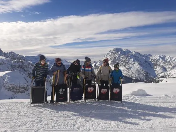 Giro in motoslitta e discesa in slittino alle Tre Cime di Lavaredo